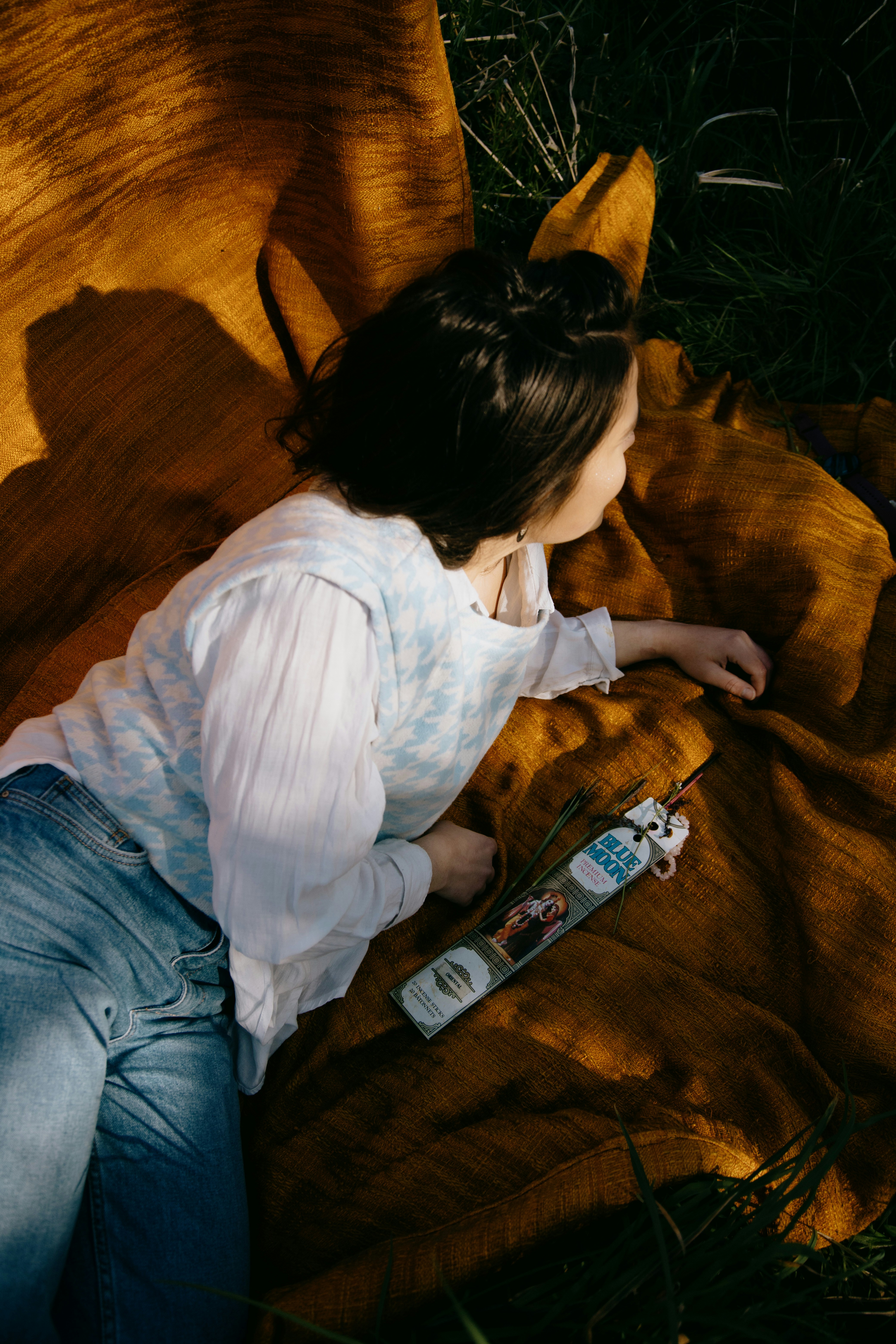 Thumbnail of a woman preparing a bath with herbs, suggesting a mystical and natural process.