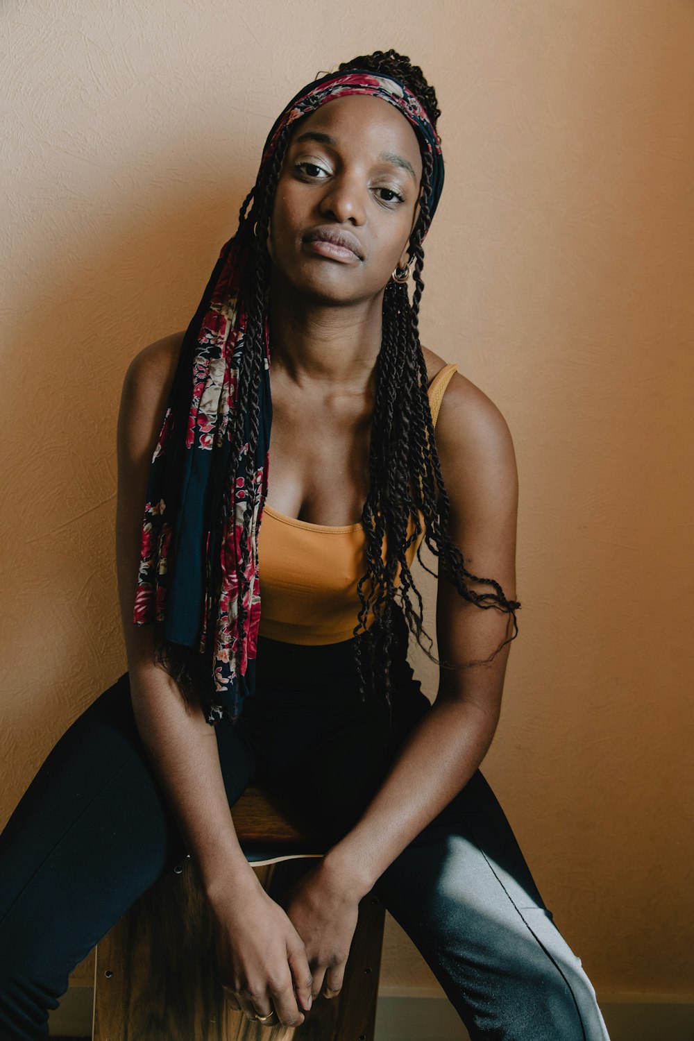 woman in black tank top and pink scarf