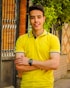 man in yellow polo shirt wearing black round analog watch