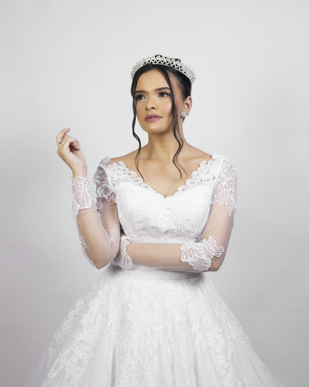 woman in white floral dress wearing white floral tiara