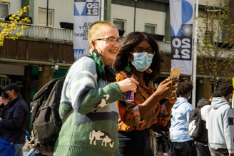Stylish man and woman walking outdoors wearing casual modern outfits