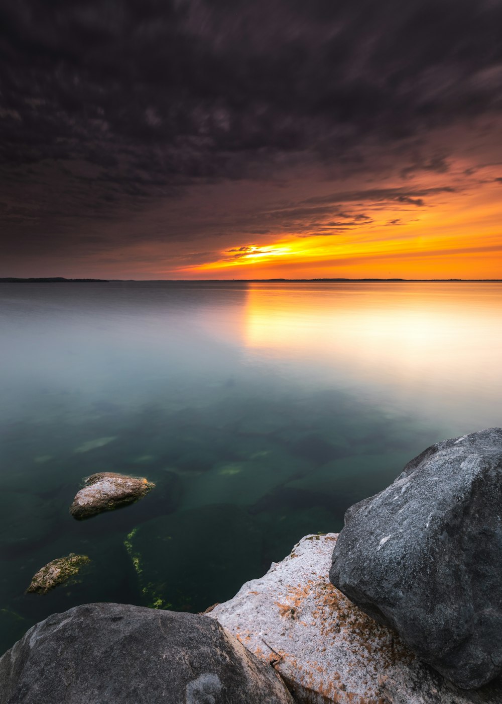 gray rocky shore during sunset