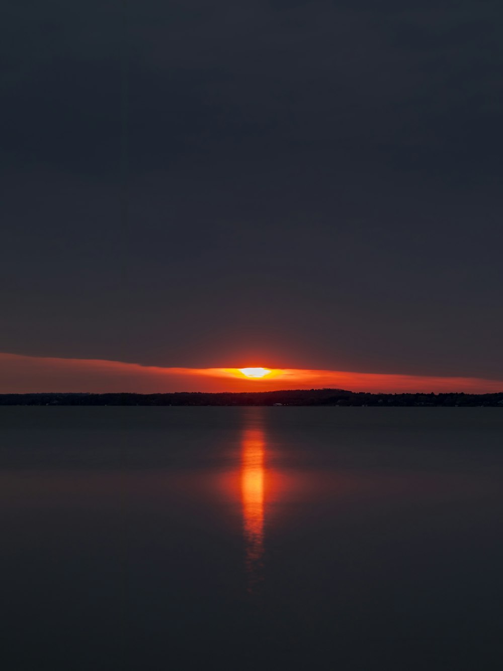 body of water during sunset