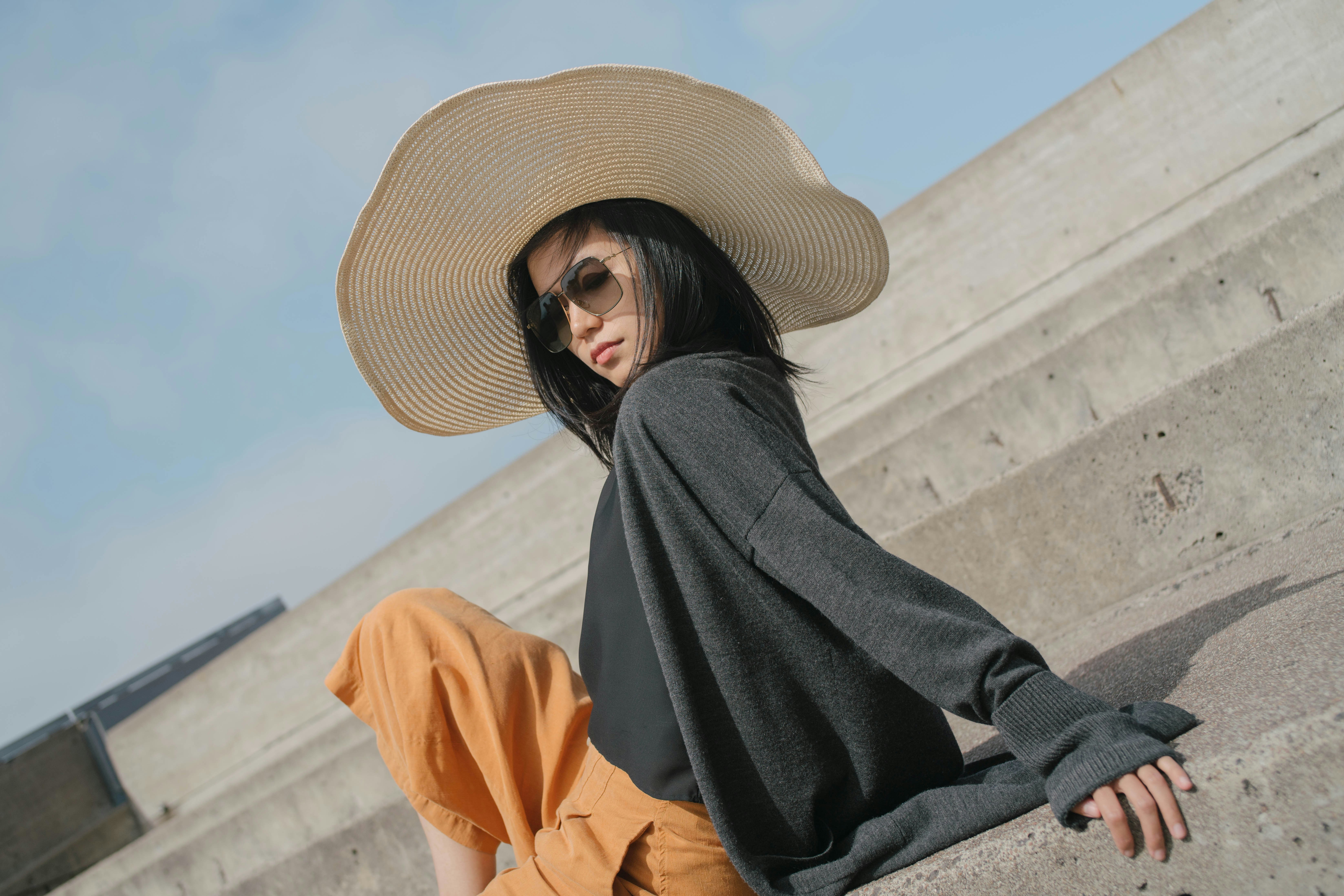 woman in black long sleeve shirt and brown sun hat