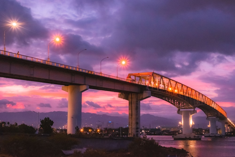 white bridge over river during night time