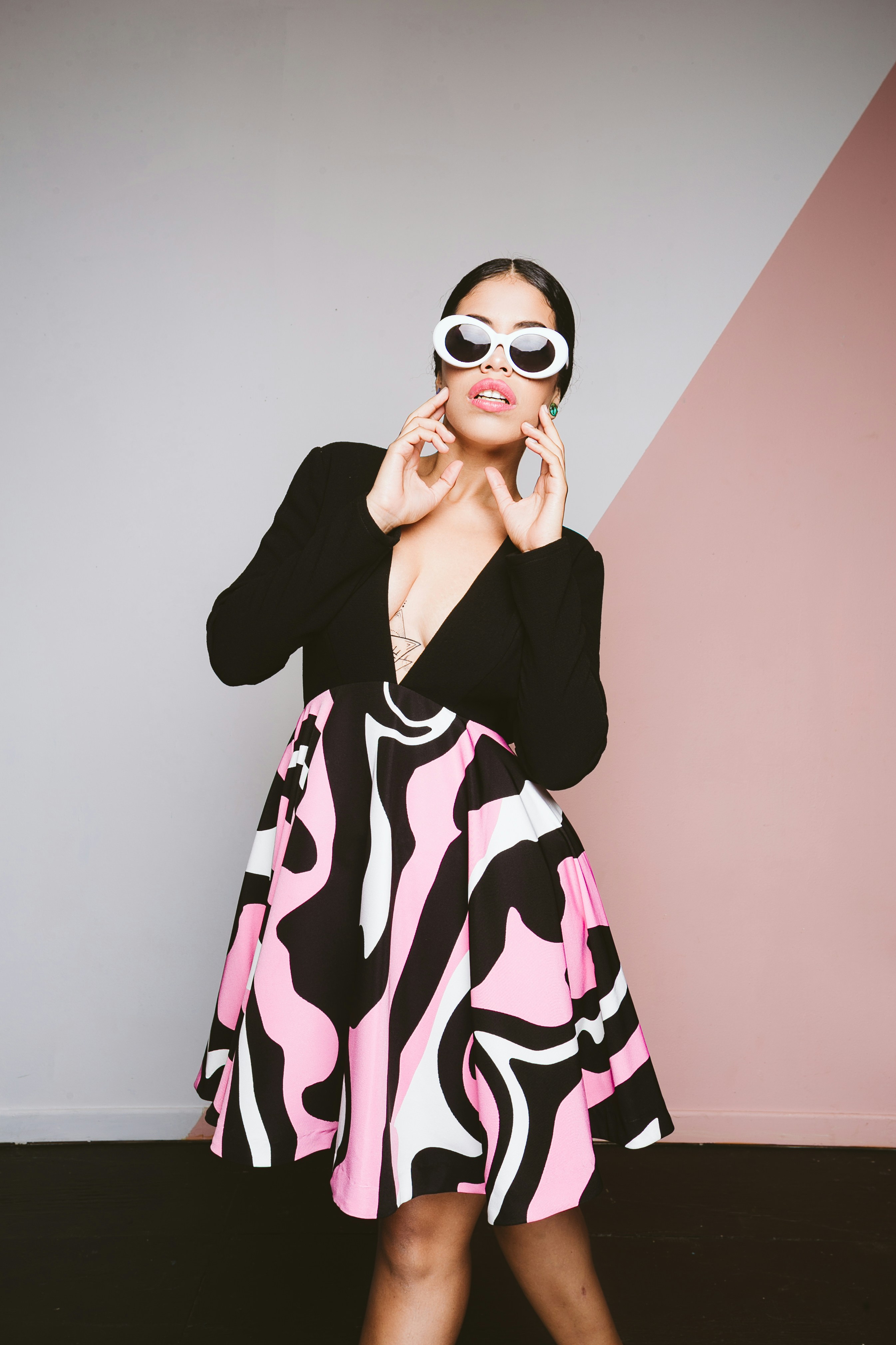 woman in black and white long sleeve dress wearing sunglasses