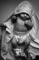 grayscale photo of woman in white and black hijab
