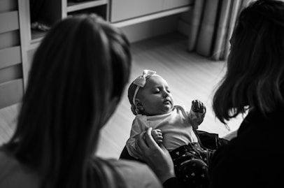 grayscale photo of woman and child