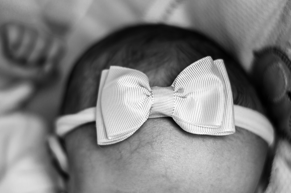 grayscale photo of bow tie