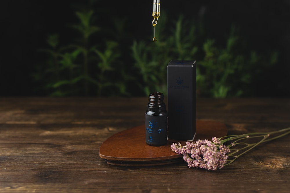 black and silver box mod on brown wooden table