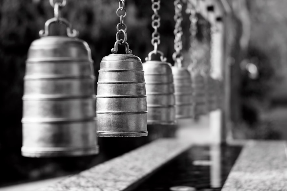 silver chain link necklace in grayscale photography