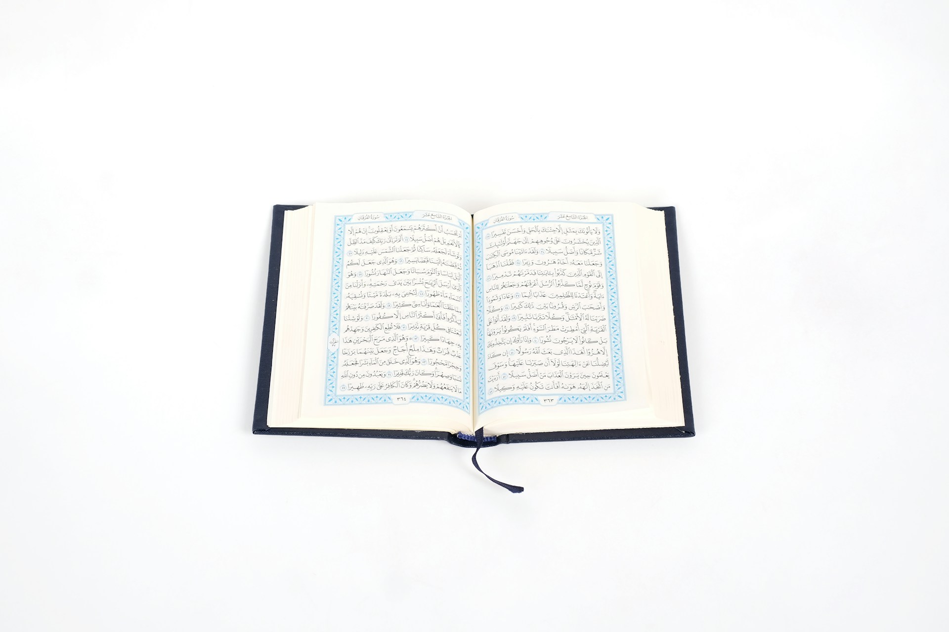 opened book on white table