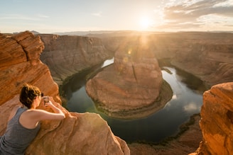 Sunset over the horseshoe-shaped bend of the Strawberry River, framed by lush Ozark foothills.
