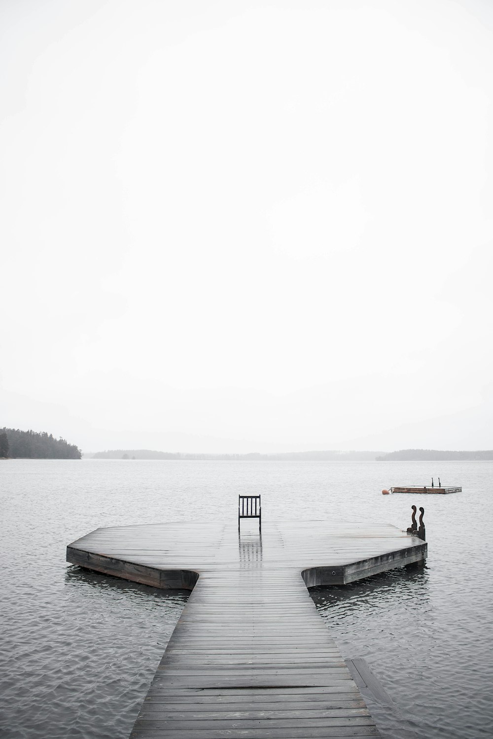 brown wooden dock on body of water during daytime