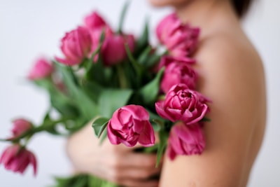 pink roses on persons lap