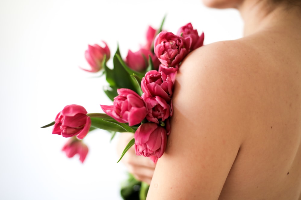 woman with pink roses on her lap