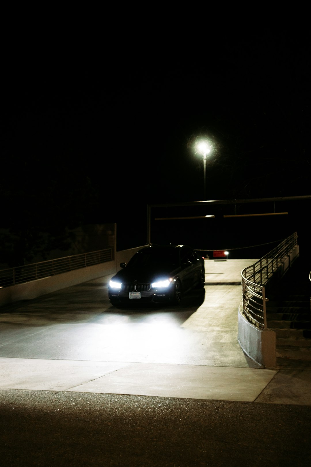 black car on gray concrete road