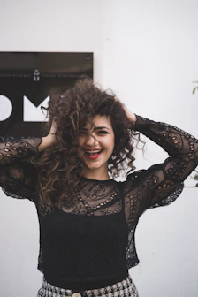 woman in black long sleeve shirt smiling