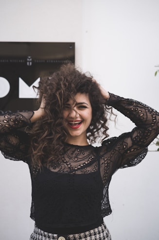 woman in black long sleeve shirt smiling