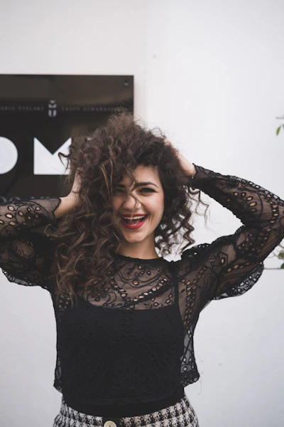 woman in black long sleeve shirt smiling