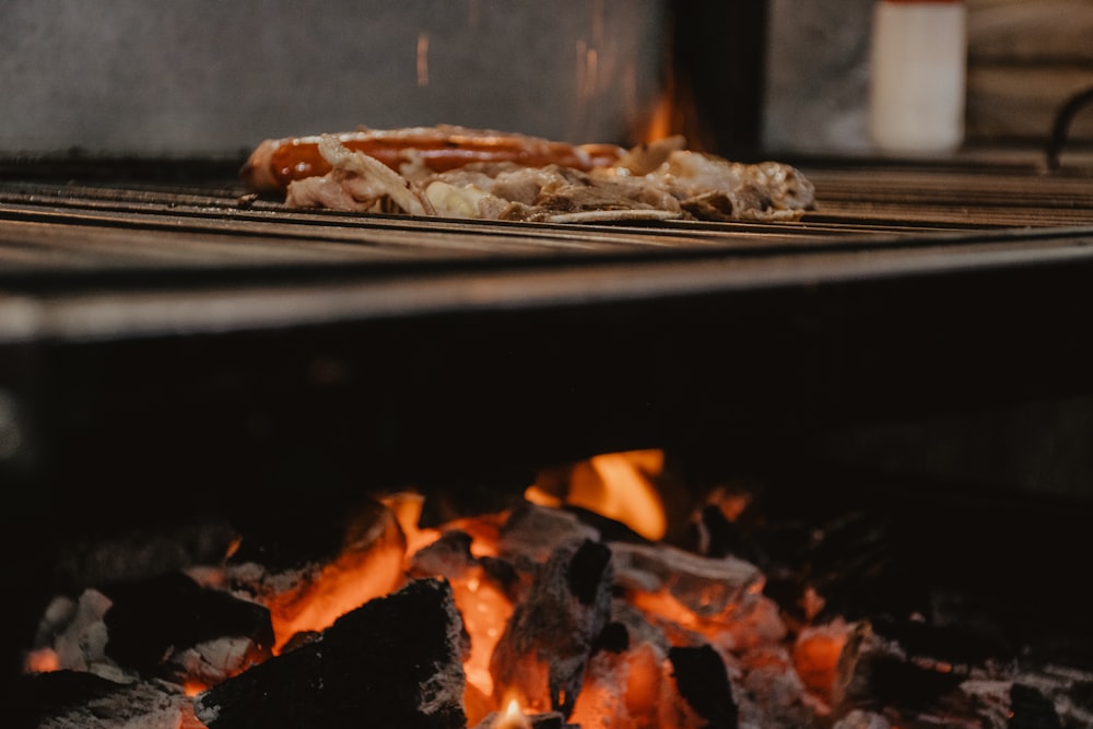 grilled meat on gray metal grill