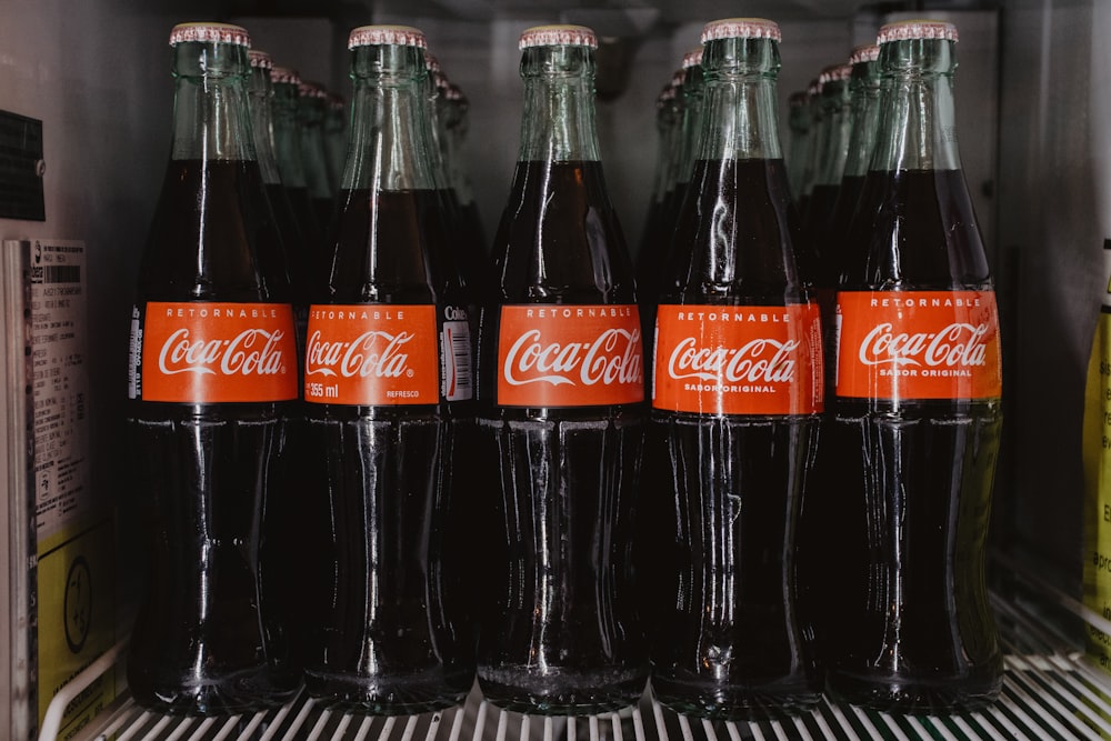 coca cola bottles on white table