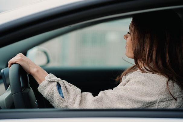 Woman behind the wheel participating in our courses