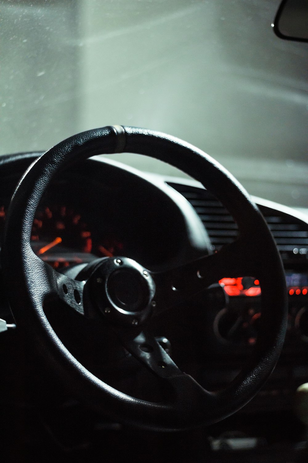 black steering wheel in close up photography