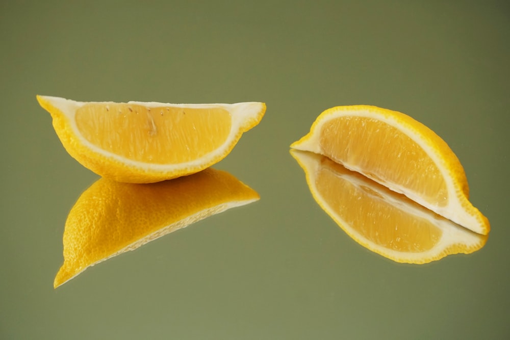 sliced lemon on white surface