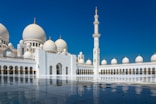 white and gold dome building under blue sky during daytime