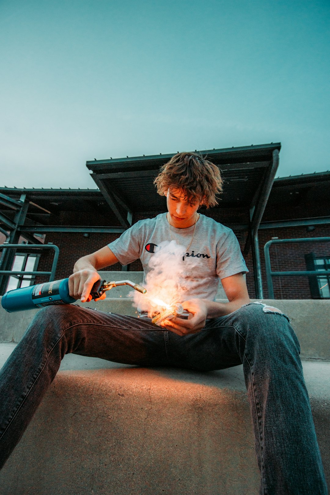 man in white crew neck t-shirt smoking cigarette