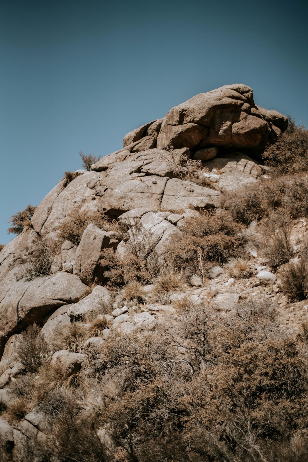 brown rock formation under blue sky during daytime