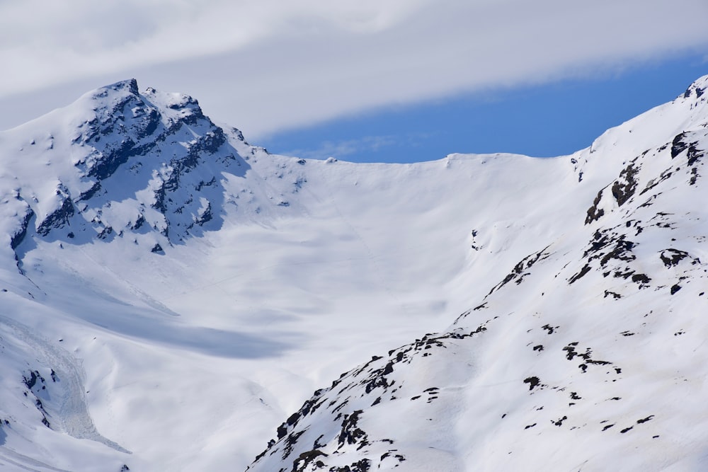 snow covered mountain under blue sky during daytime