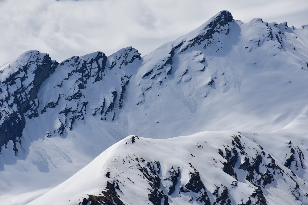 snow covered mountain during daytime