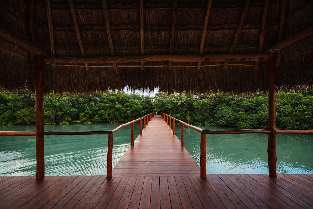 brown wooden bridge over the swimming pool