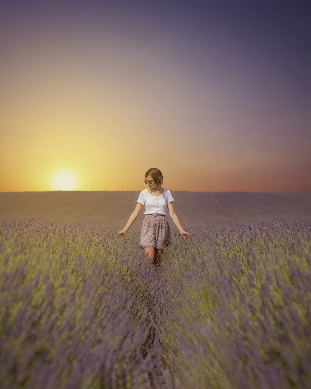 girl in white dress running on green grass field during daytime