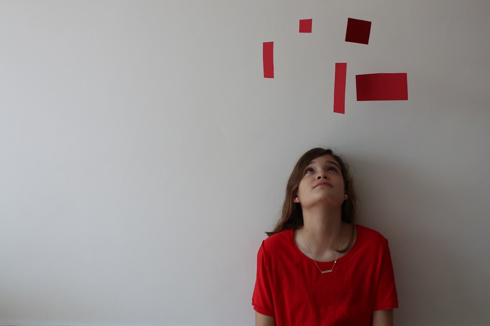 woman in red v neck t-shirt