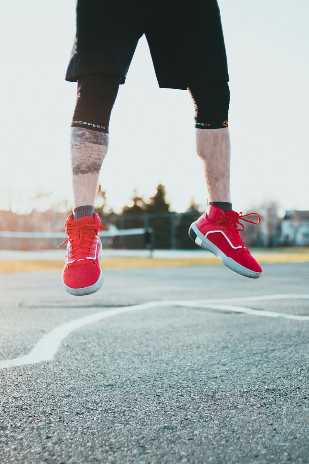 person in red nike sneakers photo – Free Footwear Image on Unsplash