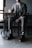 man in black suit sitting on chair