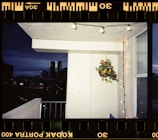 A bright balcony with a view of the city skyline.