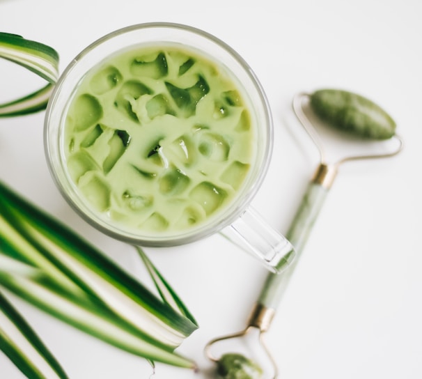 green and white ceramic bowl with green liquid