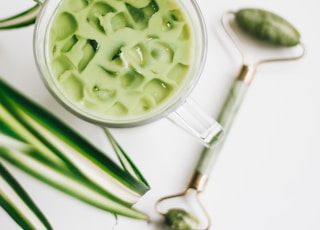 green and white ceramic bowl with green liquid