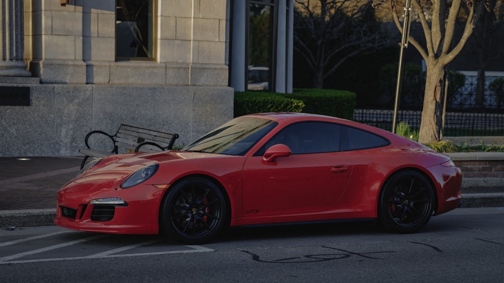 red ferrari 458 italia parked on road side during daytime