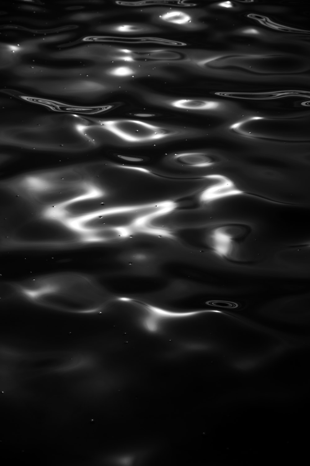 water droplets on black surface