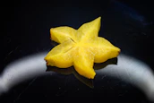 yellow star ornament on black surface