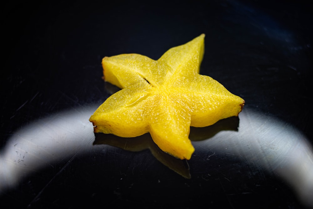 yellow star ornament on black surface