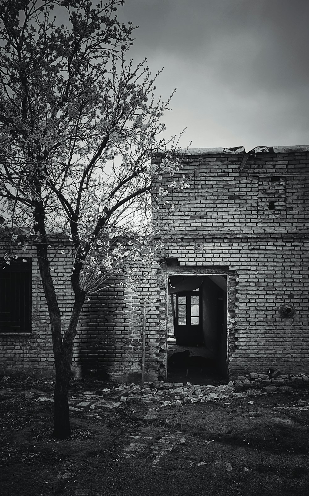 grayscale photo of brick building