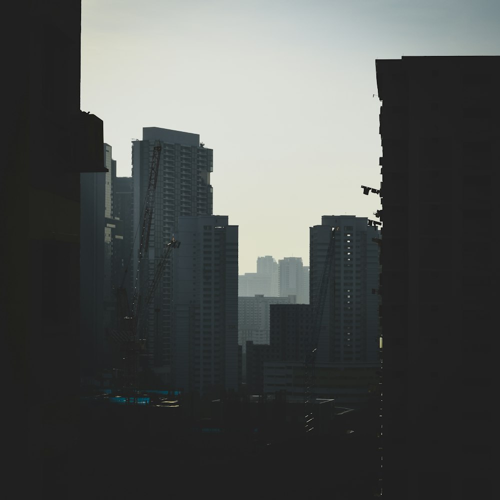 silhouette of city buildings during sunset