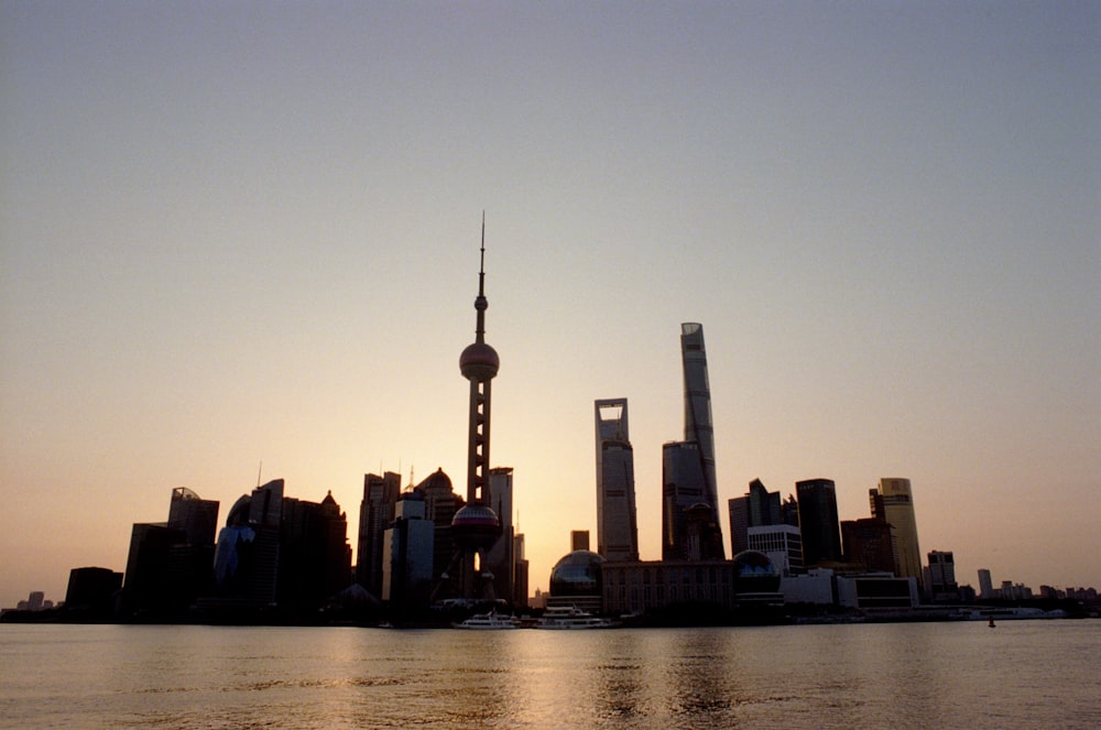 silhouette of city buildings during sunset