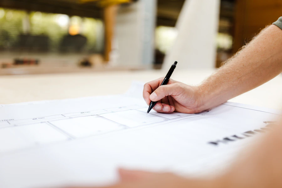 Project engineer marking up a set of construction drawings